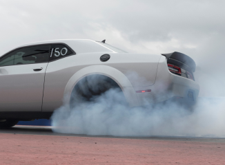 An SRT Demon 170 smokes its tires