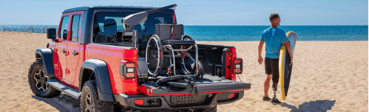 Jeep Gladiator equipped with wheelchair lift parked on beach