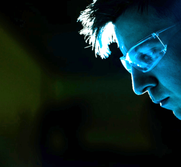 Man staring at blue glow